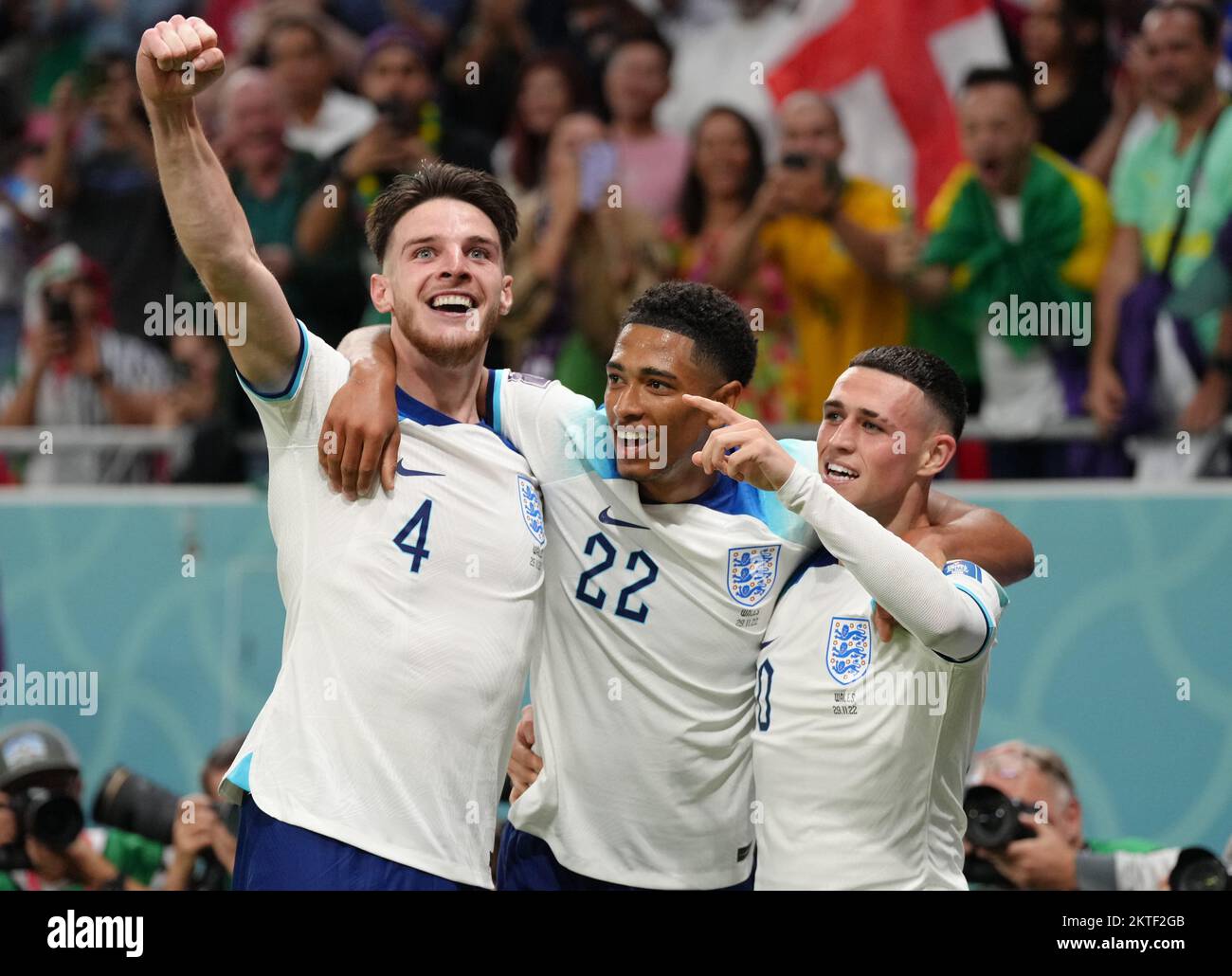 England's Phil Foden (right) celebrates scoring the second goal with Jude Bellingham and Declan Rice during the FIFA World Cup Group B match at the Ahmad Bin Ali Stadium, Al Rayyan, Qatar. Picture date: Tuesday November 29, 2022. Stock Photo