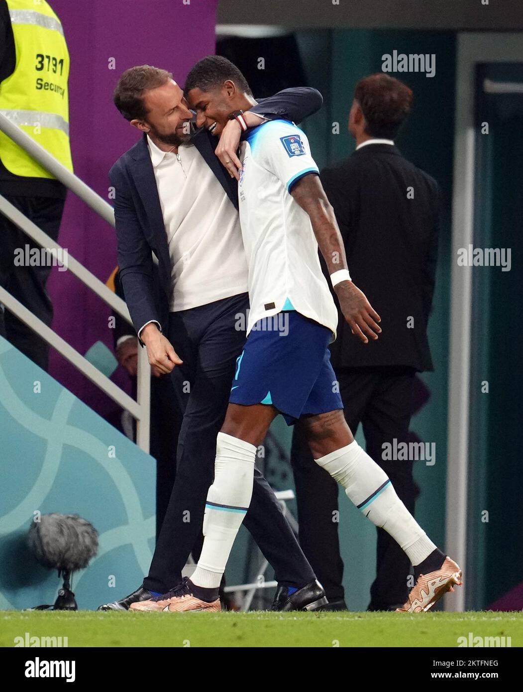 England's Marcus Rashford with manager Gareth Southgate as he is substituted during the FIFA World Cup Group B match at the Ahmad Bin Ali Stadium, Al Rayyan, Qatar. Picture date: Tuesday November 29, 2022. Stock Photo
