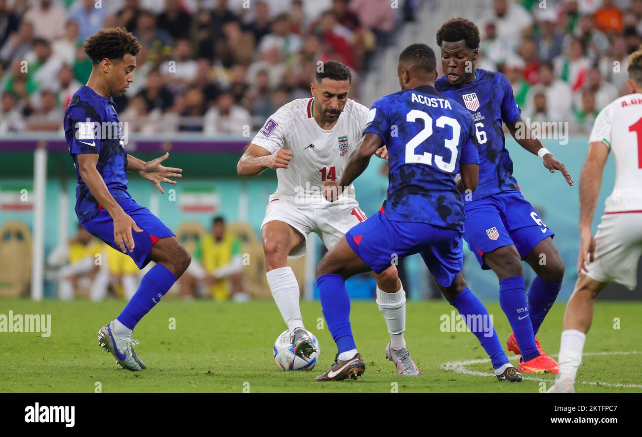 Iranian Saman Ghoddos and US Kellyn Acosta fight for the ball during a soccer game between Iran and USA, the third and last game in the Group B of the FIFA 2022 World Cup in Al Thumama Stadium, Doha, State of Qatar on Tuesday 29 November 2022. BELGA PHOTO VIRGINIE LEFOUR Stock Photo