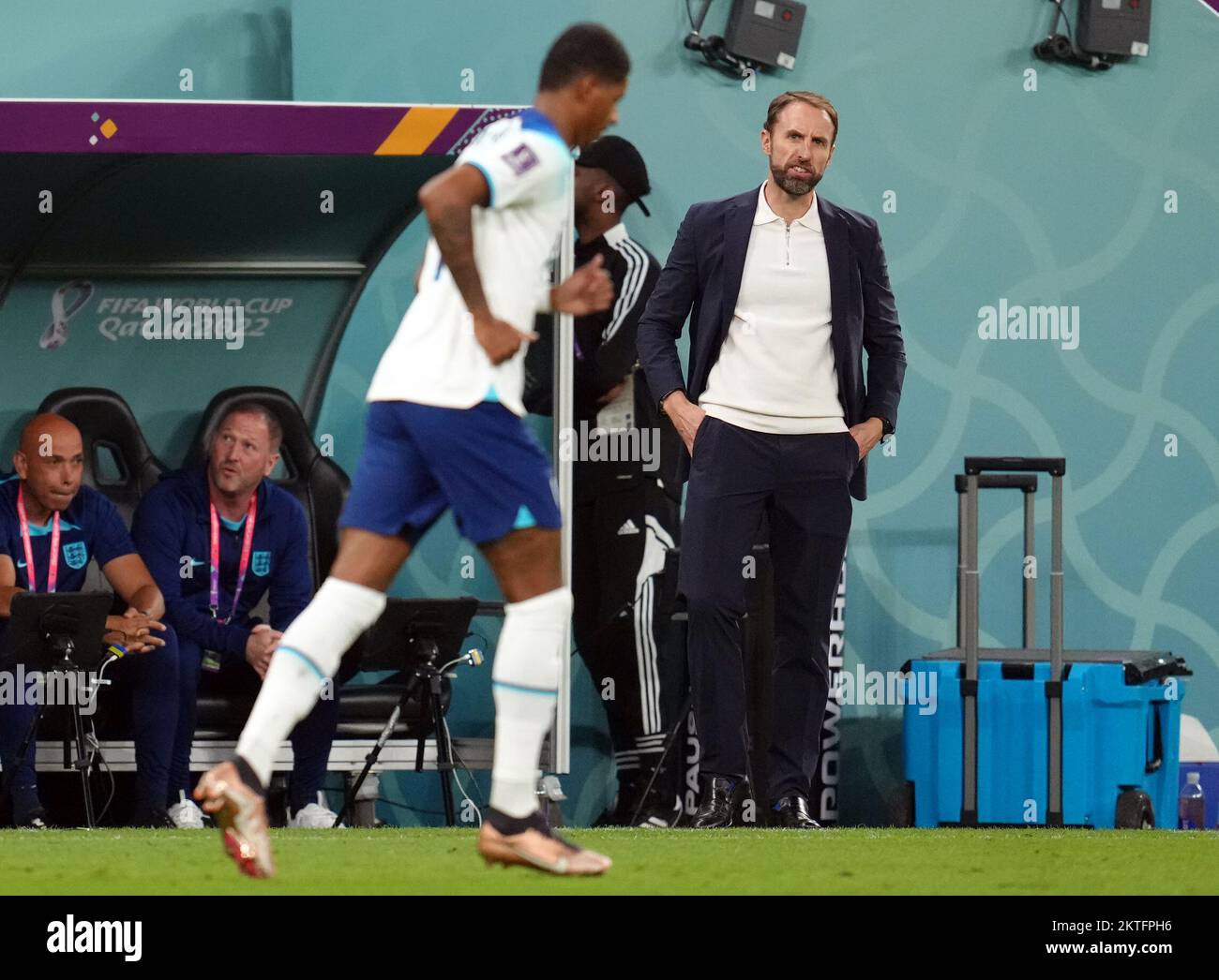 England manager Gareth Southgate (right) watches goal scorer Marcus Rashford during the FIFA World Cup Group B match at the Ahmad Bin Ali Stadium, Al Rayyan, Qatar. Picture date: Tuesday November 29, 2022. Stock Photo
