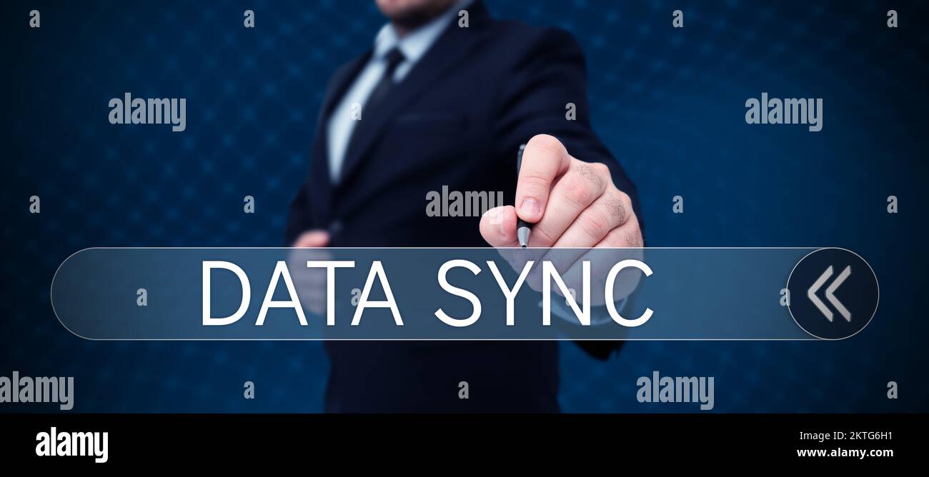 Writing displaying text Data Sync, Word Written on data that is continuously generated by different sources Stock Photo