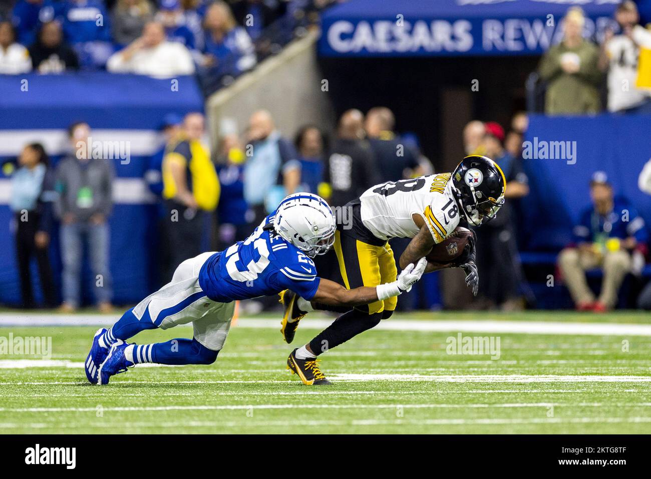 Indianapolis, Indiana, USA. 28th Nov, 2022. Indianapolis Colts defensive back Kenny Moore II (23) makes tackle on Pittsburgh Steelers wide receiver Diontae Johnson (18) during NFL game in Indianapolis, Indiana. John Mersits/CSM/Alamy Live News Stock Photo