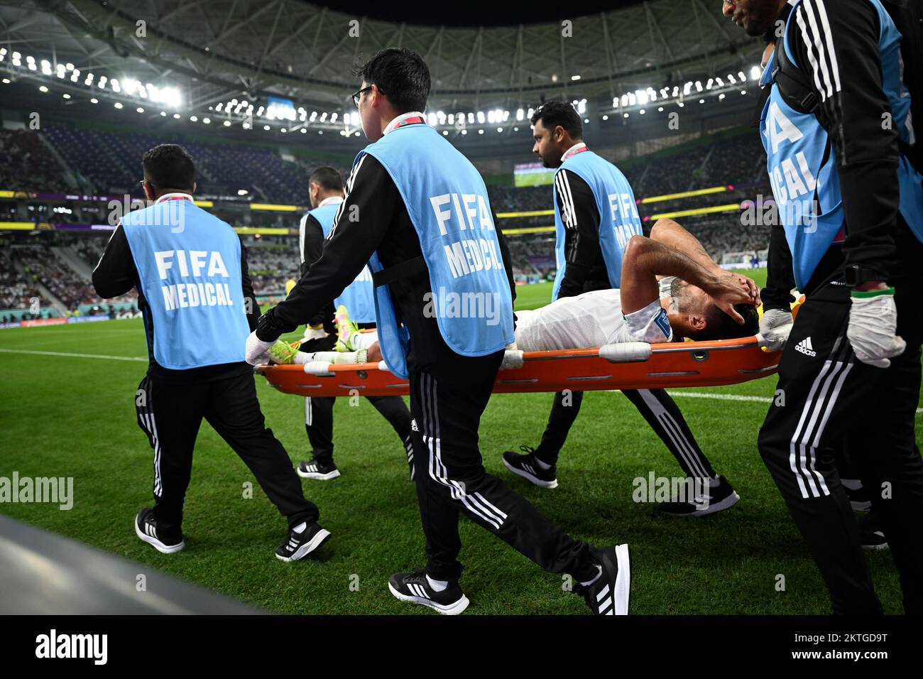 Doha, Qatar. 29th Nov, 2022. Milad Mohammadi (C) of Iran is injured during the Group B match between Iran and the United States at the 2022 FIFA World Cup at Al Thumama Stadium in Doha, Qatar, Nov. 29, 2022. Credit: Li Ga/Xinhua/Alamy Live News Stock Photo