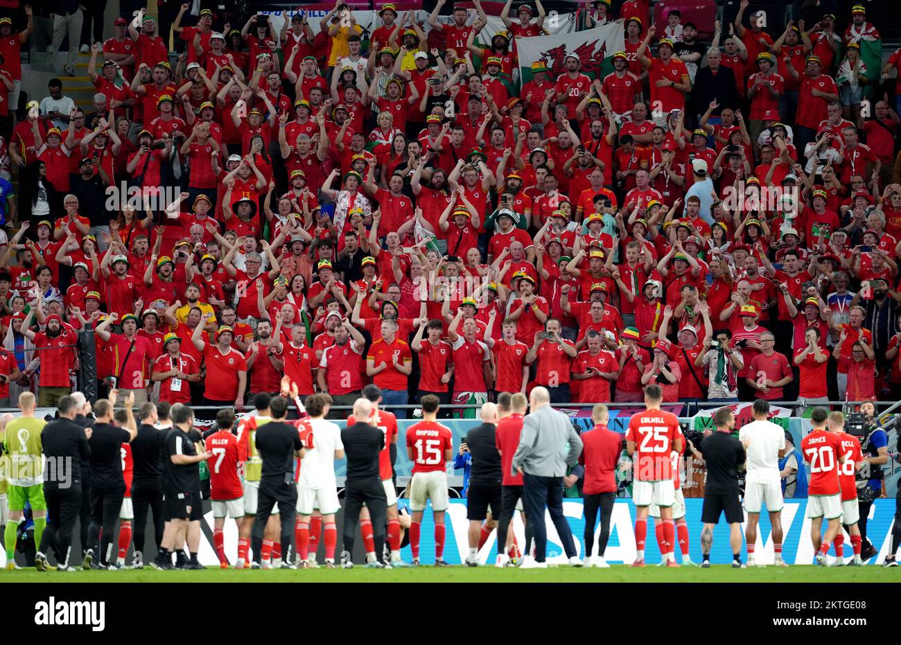 Wales players applaud the travelling supporters following the FIFA World Cup Group B match at the Ahmad Bin Ali Stadium, Al Rayyan, Qatar. Picture date: Tuesday November 29, 2022. Stock Photo