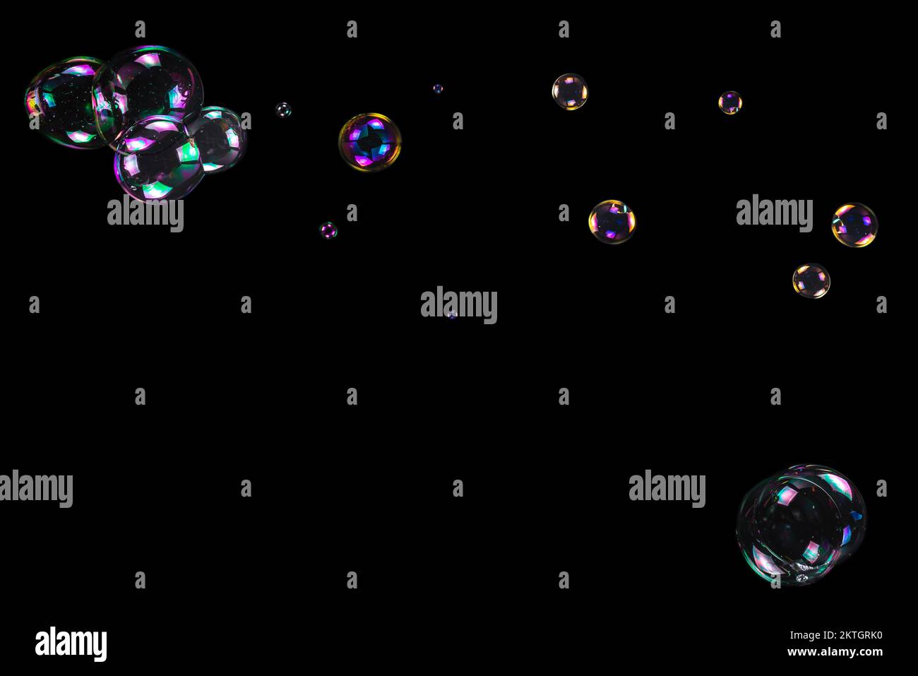 Soap bubbles isolated on a black background. Copy space Stock Photo - Alamy