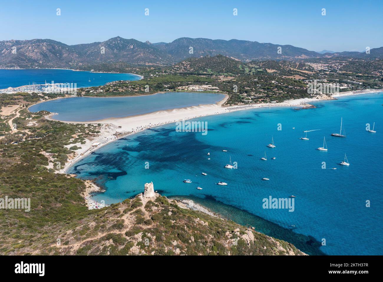 Aerial view of Spiaggia di Porto Giunco, a beautiful bay near a 17th century watchtower, The Aragonese Tower of Porto Giunco, in Sardinia, Italy Stock Photo
