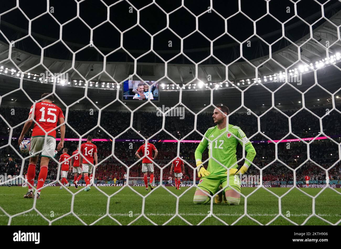 Wales goalkeeper Danny Ward sits dejected after failing to stop England's Marcus Rashford scoring the third goal during the FIFA World Cup Group B match at the Ahmad Bin Ali Stadium, Al Rayyan, Qatar. Picture date: Tuesday November 29, 2022. Stock Photo