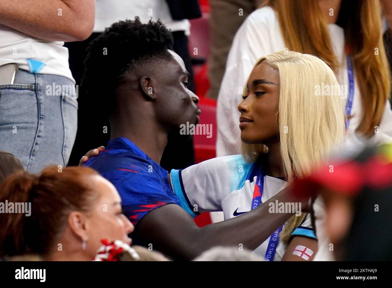 England’s Bukayo Saka with his partner Tolami Benson after the match