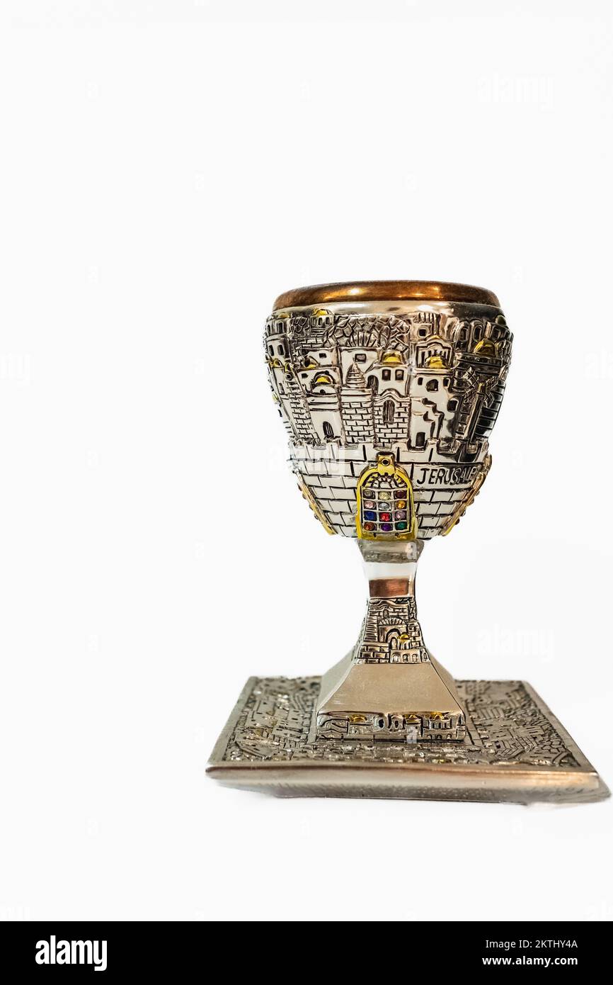Shabbath kiddush cup. Top view image of jewish wine cup for wine. passover holiday and shabbat concept. Silver goblet isolated on a white background, Stock Photo