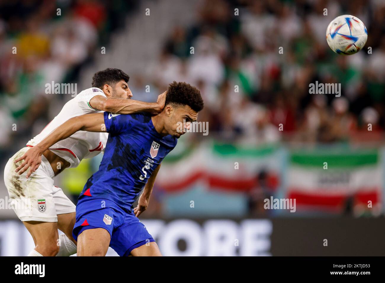 Doha, Catar. 29th Nov, 2022. TORABI Mehdi of Iran disputes the ball with ROBINSON Antonee of the United States during a match between Iran and the United States, valid for the group stage of the World Cup, held at Al Thumama Stadium in Doha, Qatar. Credit: Marcelo Machado de Melo/FotoArena/Alamy Live News Stock Photo