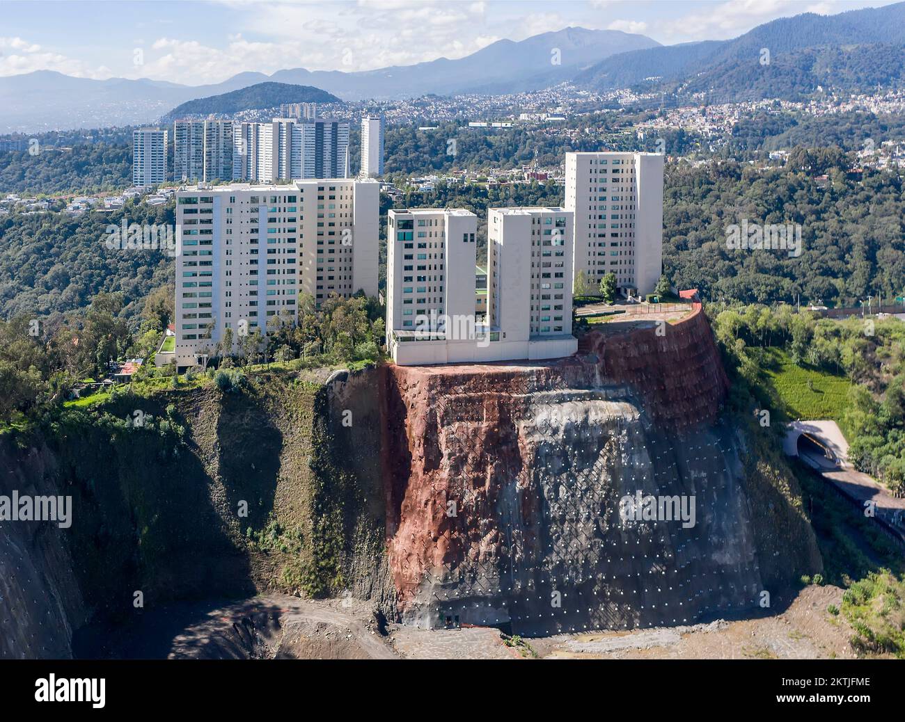 Highrise buildings on dangerouslooking esacarpment that has been
