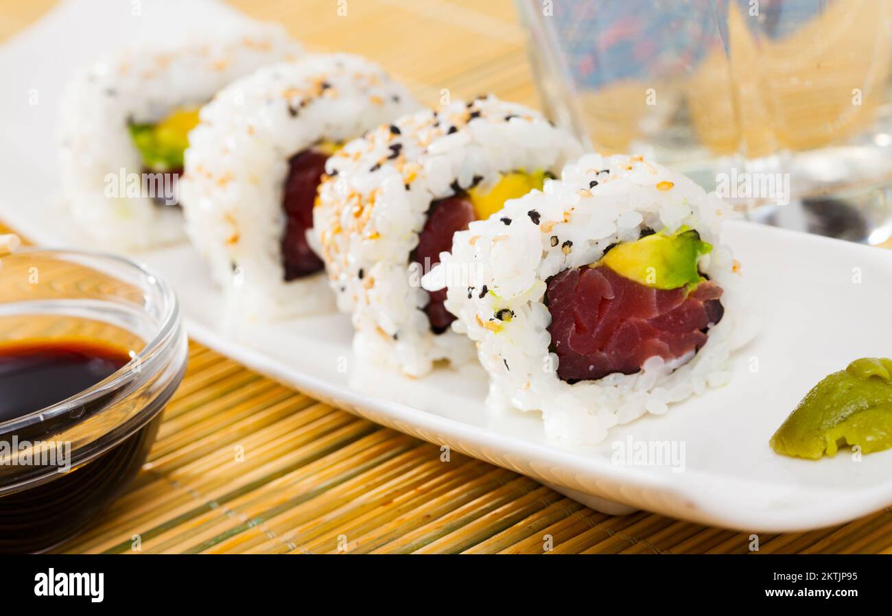 Tuna and avocado sushi uramaki Stock Photo - Alamy