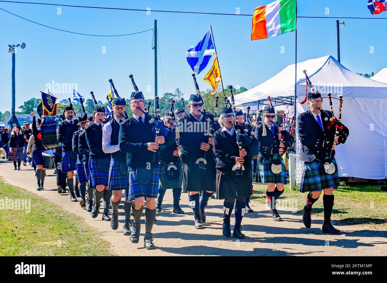 Scottish pipers play the bagpipes as they march in the parade of tartans during the annual Celtic Music Festival in Gulfport, Mississippi. Stock Photo