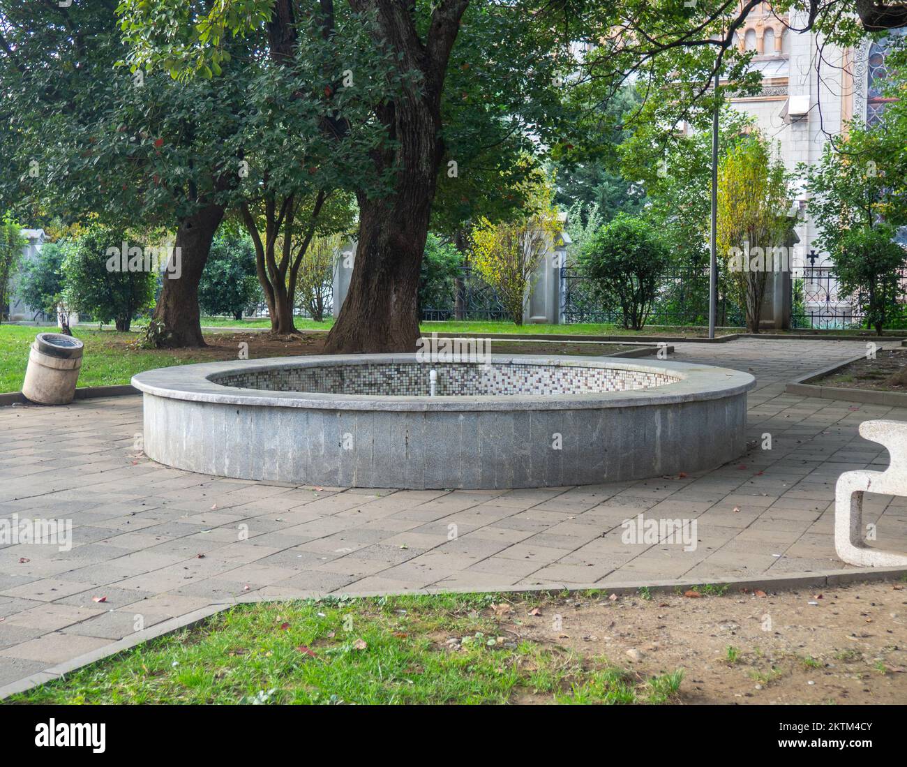 Non-working fountain in the park in autumn. Not a season. There is no water. Old fountain without water Stock Photo
