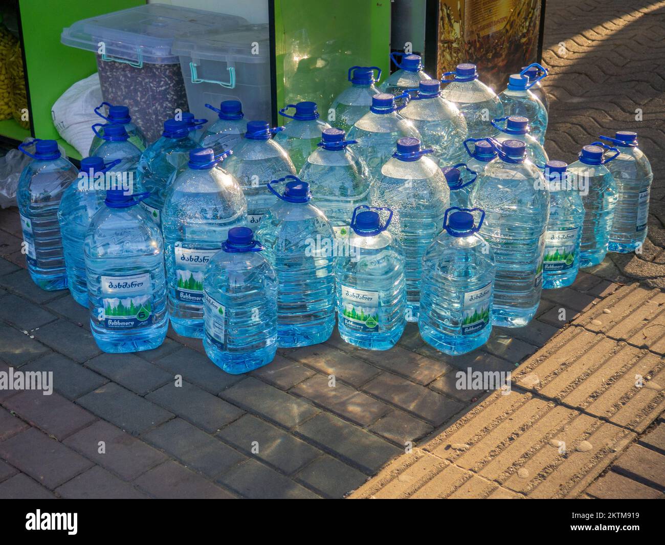 Batumi, Georgia. 11.23.2022 Sale of water in five-liter bottles. Hot season. Resort water. Lots of plastic bottles outside. Stock Photo