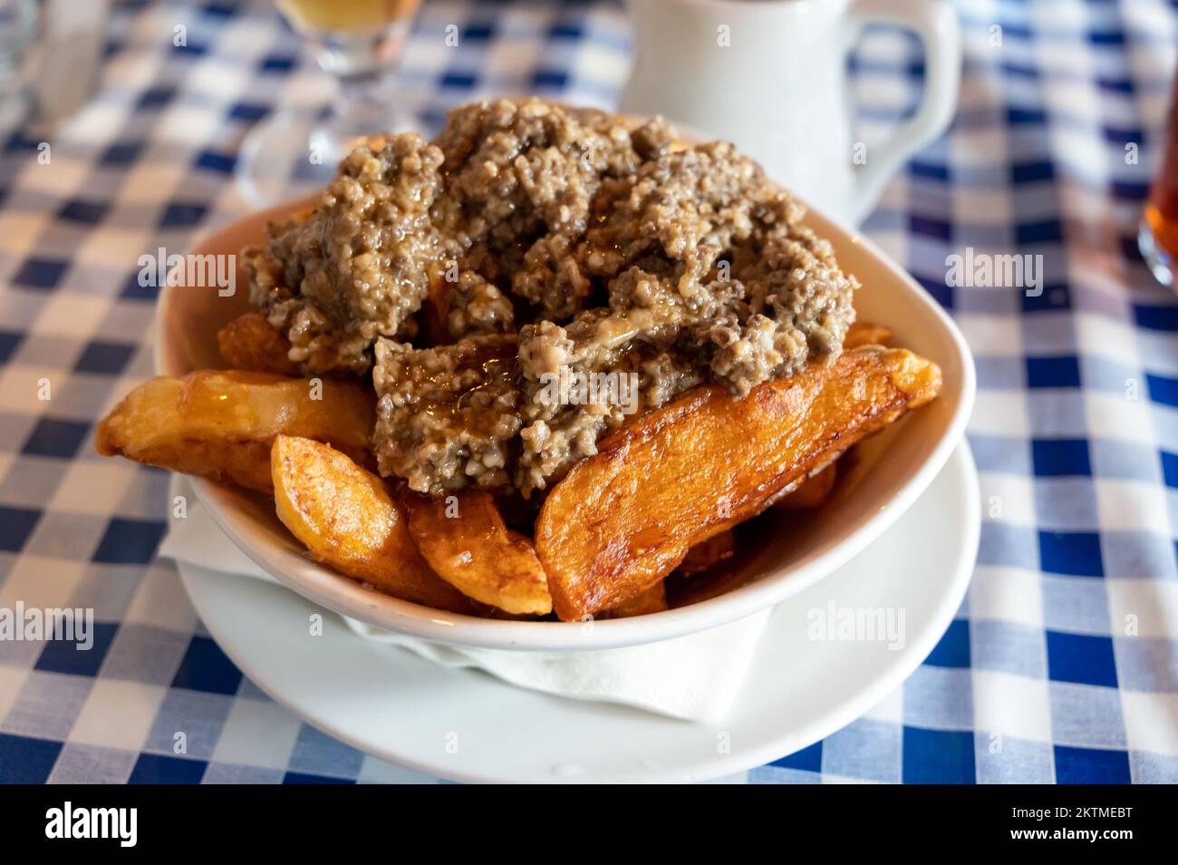 Scottish traditional snack food, hand cut potato chips topped with