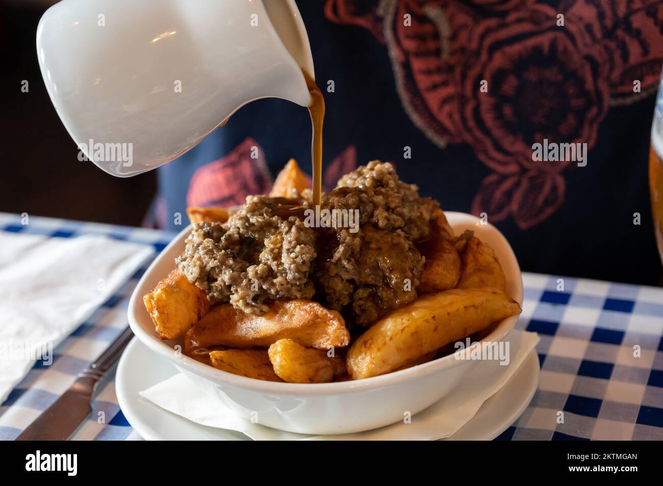 Scottish traditional snack food, hand cut potato chips topped with