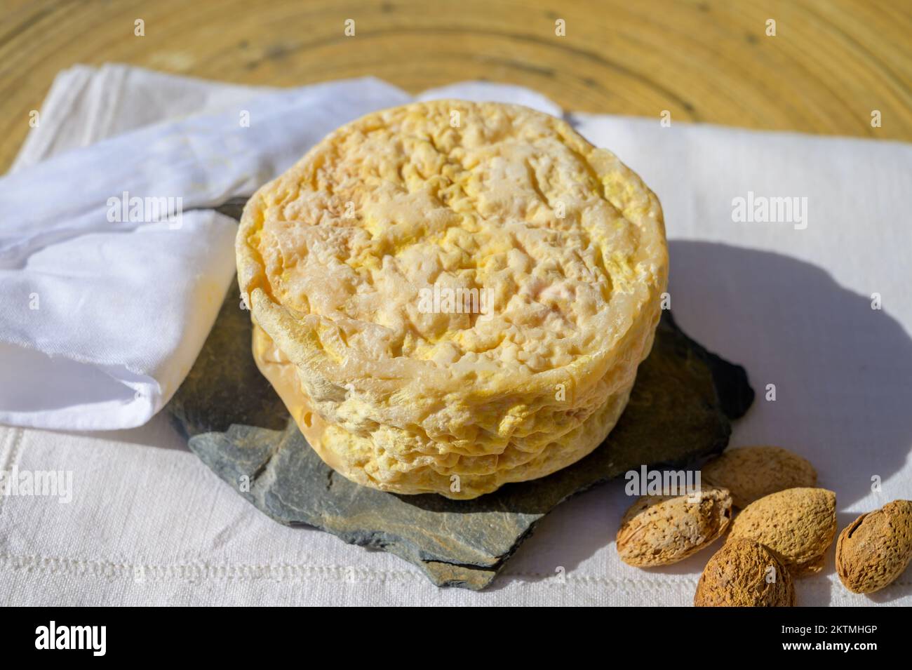Tasting of local portuguese matured cheese queijo serpa, Setubal area, Portugal, close up Stock