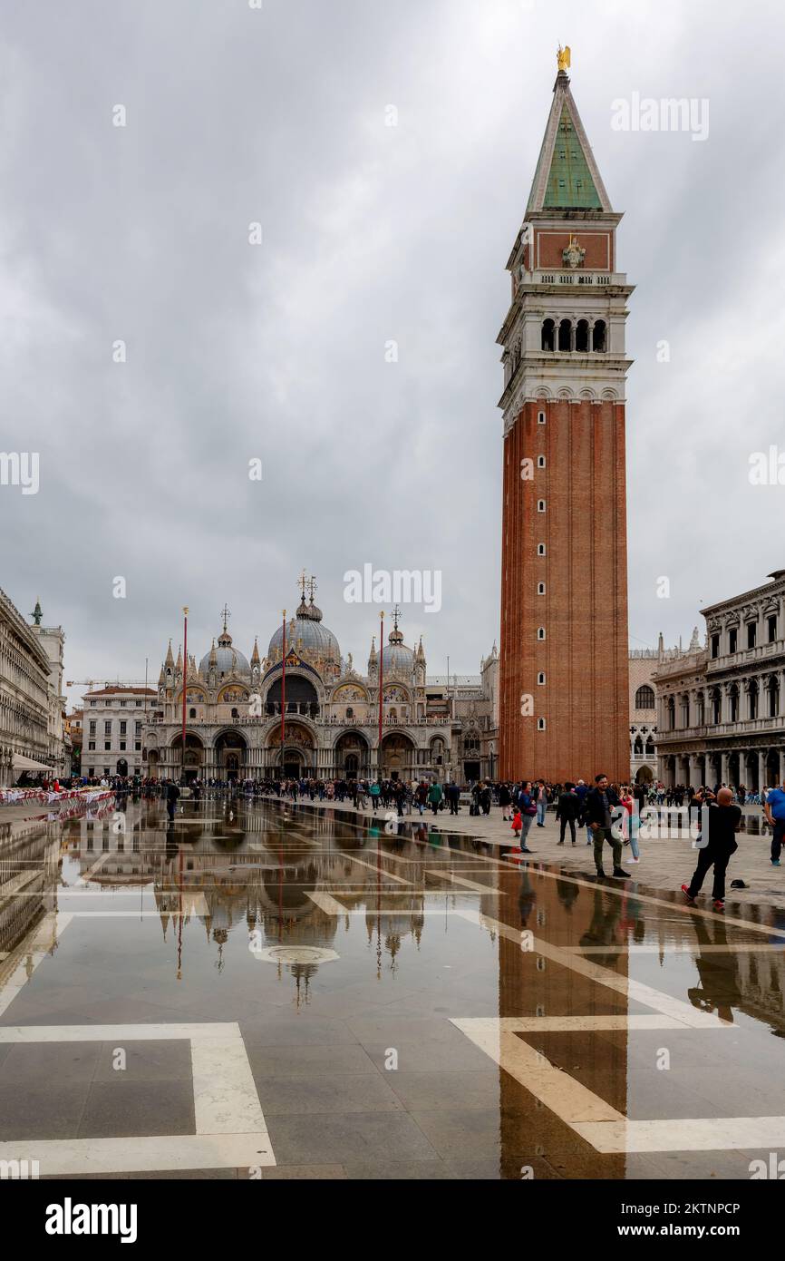 People walk around the San Marco square in raining day in Venice, Italy Stock Photo