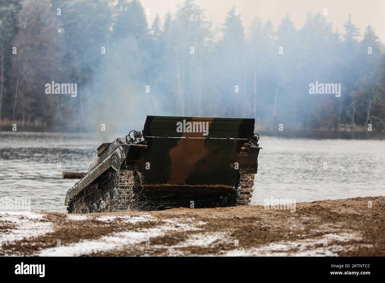 Polish soldiers assigned to 20th Mechanized Brigade operating a BMP-1 conduct amphibious assault operations during the Bull Run training exercise at Bemowo Piskie, Poland, Nov. 25, 2022. The 20th Mechanized Brigade is proudly working alongside the 1st Infantry Division, NATO allies and regional security partners to provide combat-credible forces to V Corps, under America's forward deployed corps in Europe. (U.S. Army National Guard photo by Sgt. Gavin K. Ching) Stock Photo