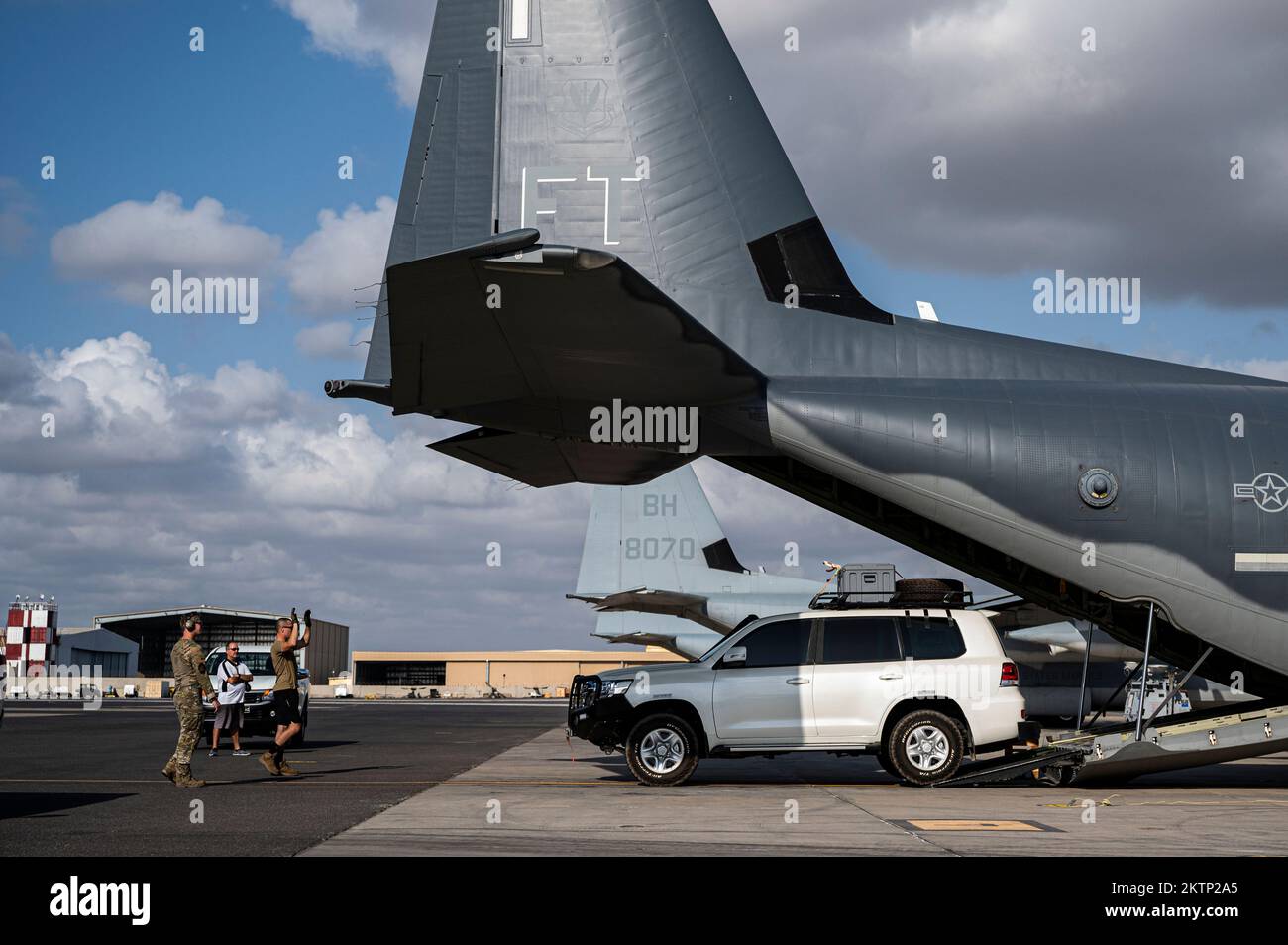 U.S. Airmen assigned to the 81st Expeditionary Rescue Squadron (ERQS) load a vehicle onto a HC-130J Combat King II on Camp Lemonnier, Djibouti, Oct. 16, 2022. The 81st ERQS is a rapidly deployable combat search and rescue force that can conduct tactical air refueling, airdrop and airland of personnel and/or equipment during day or night operations in support of combat personnel recovery within Combined Joint Task Force – Horn of Africa area of responsibility. (U.S. Air Force photo by Staff Sgt. Devin M. Rumbaugh) Stock Photo