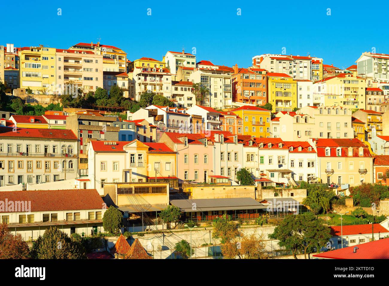 Cascading architecture of residential area, typical house buildings, red rooftops in sunset light, Porto, Portugal Stock Photo