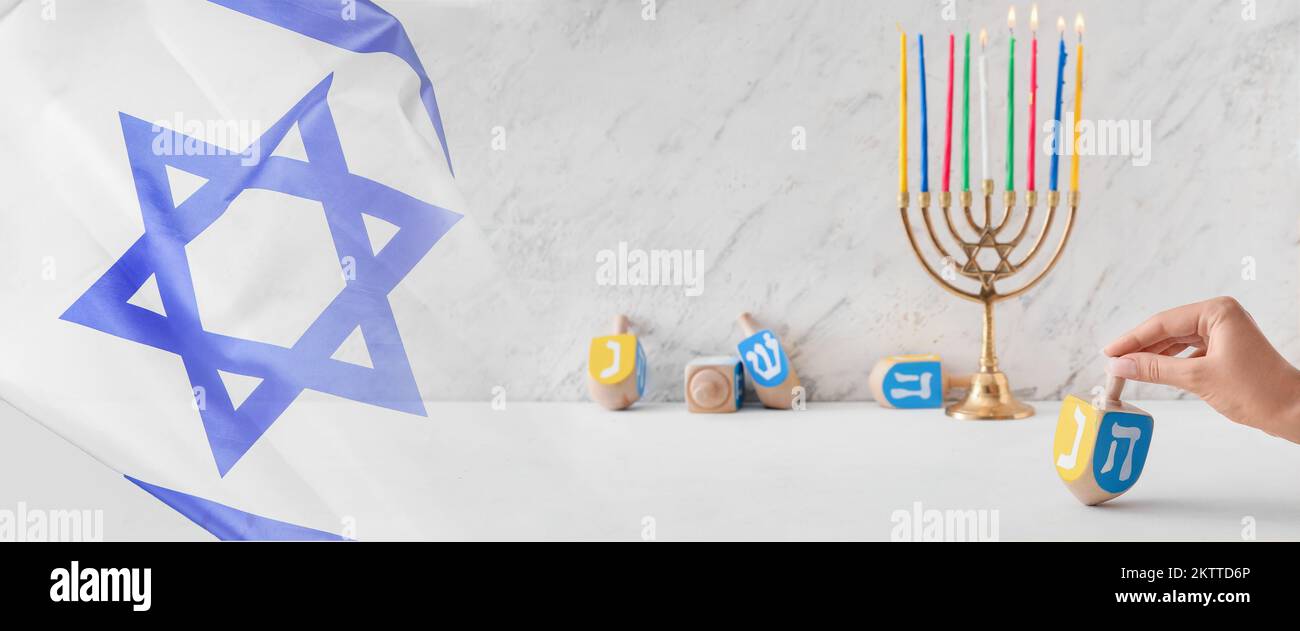 Collage of Israeli flag with menorah and dreidels for Hanukkah Stock