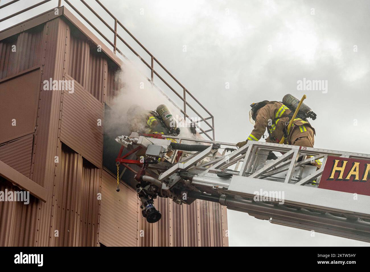 Hampton, Virginia, USA. 16th Nov, 2022. U.S. Air Force Senior Airman Brandon Franklin, 633d Civil Engineer Squadron firefighter, left, and Master Sgt. Kyle Nelson, 142d Civil Engineer Squadron Air National Guard firefighter, ascend Ladder 4 to rescue a simulated victim during a rapid intervention team work exercise in the burn building at Joint Base Langley-Eustis, Virginia, November. 17, 2022. The Ladder 4 truck has the capability to extend up to 75 feet to rescue victims at various heights. Credit: U.S. Air Force/ZUMA Press Wire Service/ZUMAPRESS.com/Alamy Live News Stock Photo