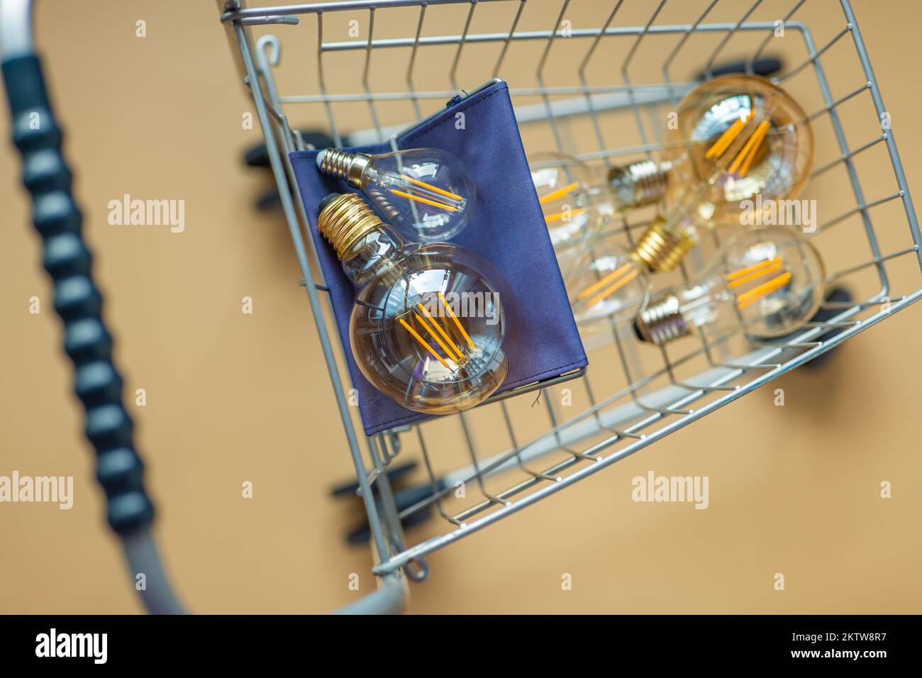 Purchase of electricity.lot of electric lamps in a shopping cart.Consumption and payment for