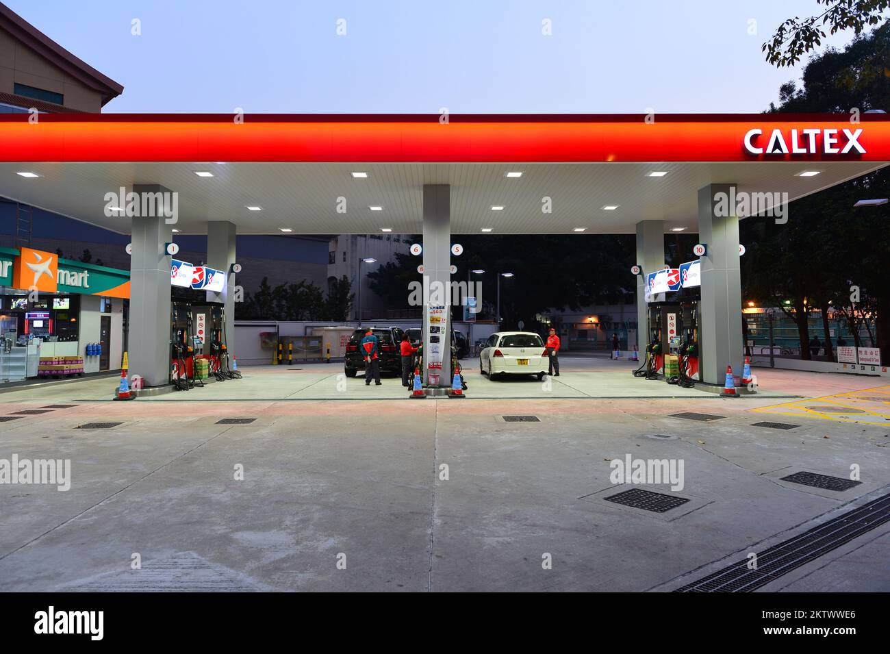 HONG KONG - FEBRUARY 04, 2015: Caltex fuel station at evening. Caltex is a petroleum brand name of Chevron Corporation used in more than 60 countries Stock Photo