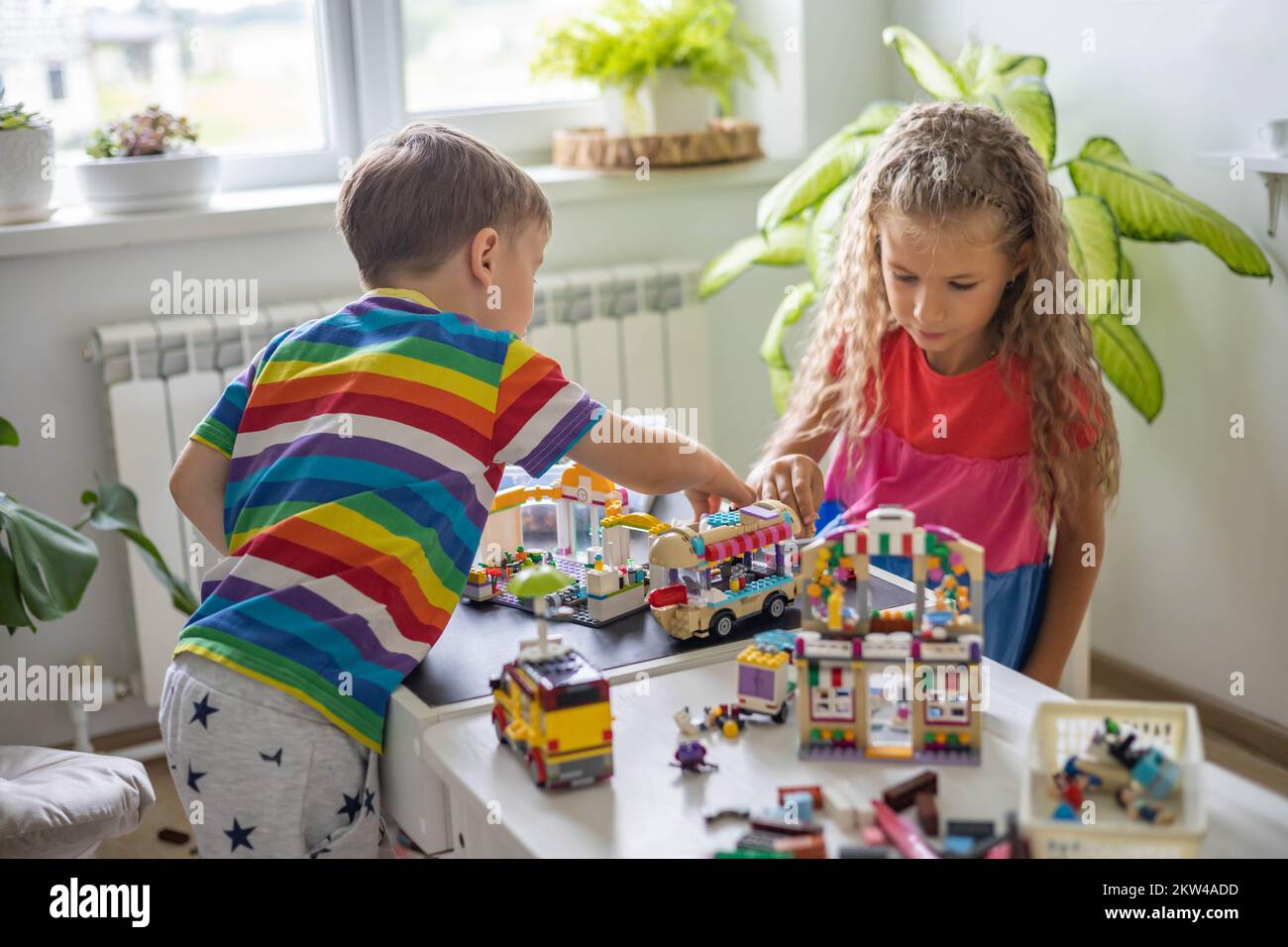 Children Using Lego Khabarovsk, Russia, August 25, 2022. Children constructing toy cars ...