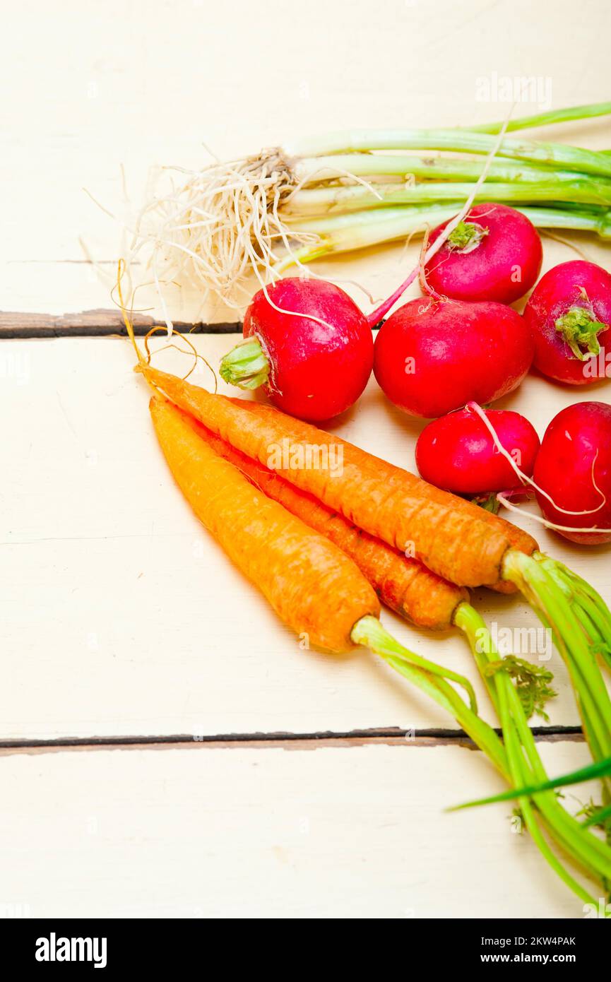 Raw root vegetable on a rustic white wood table Stock Photo
