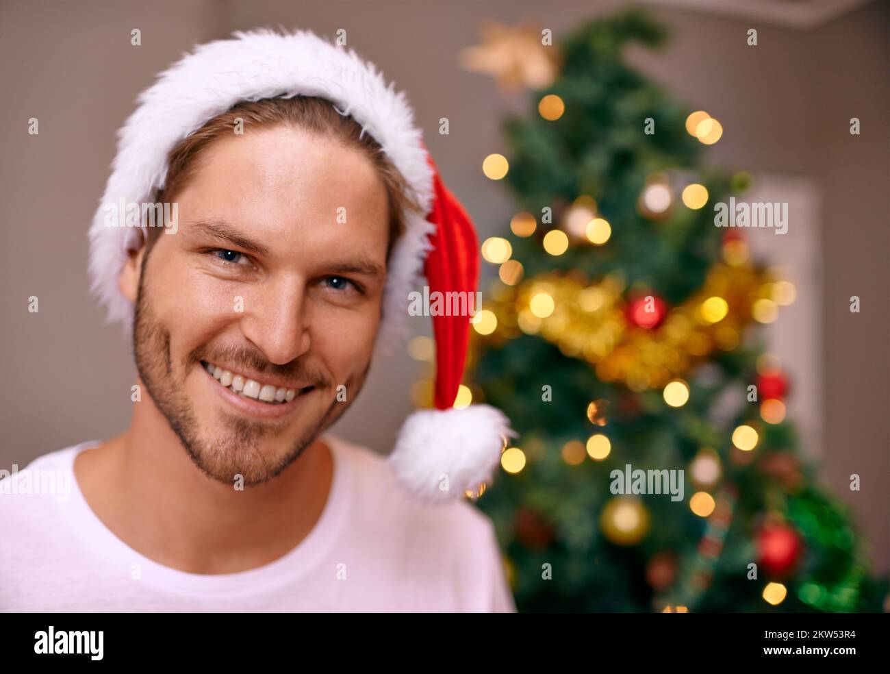Everythings ready for christmas morning. A handsome man wearing a
