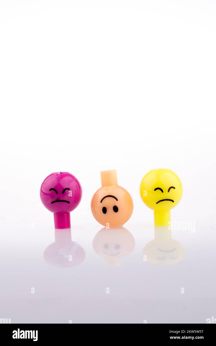 Color beads with facial expression on white background Stock Photo