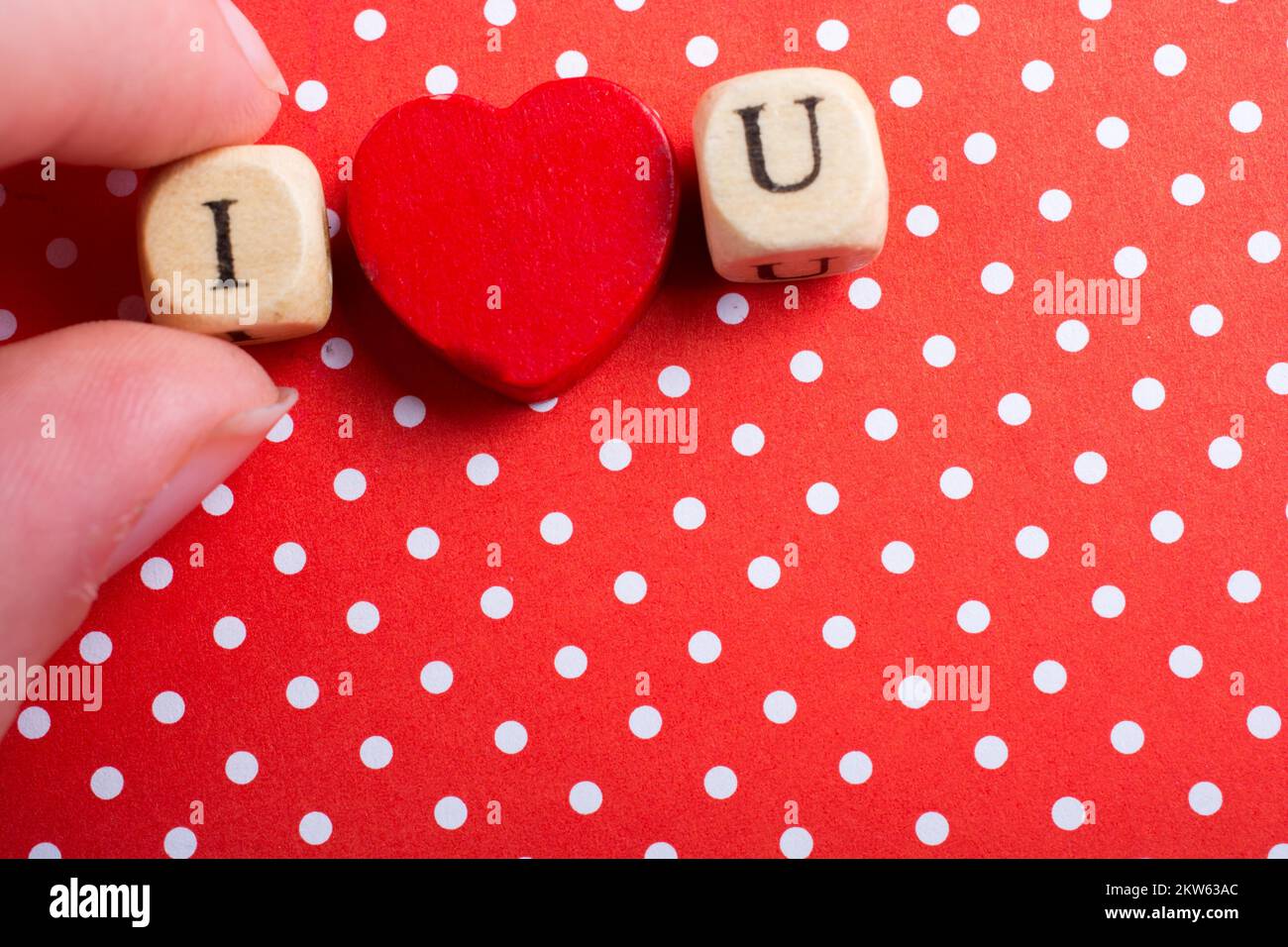 Phrase I Love You Made from Letter Cubes in in hand Stock Photo