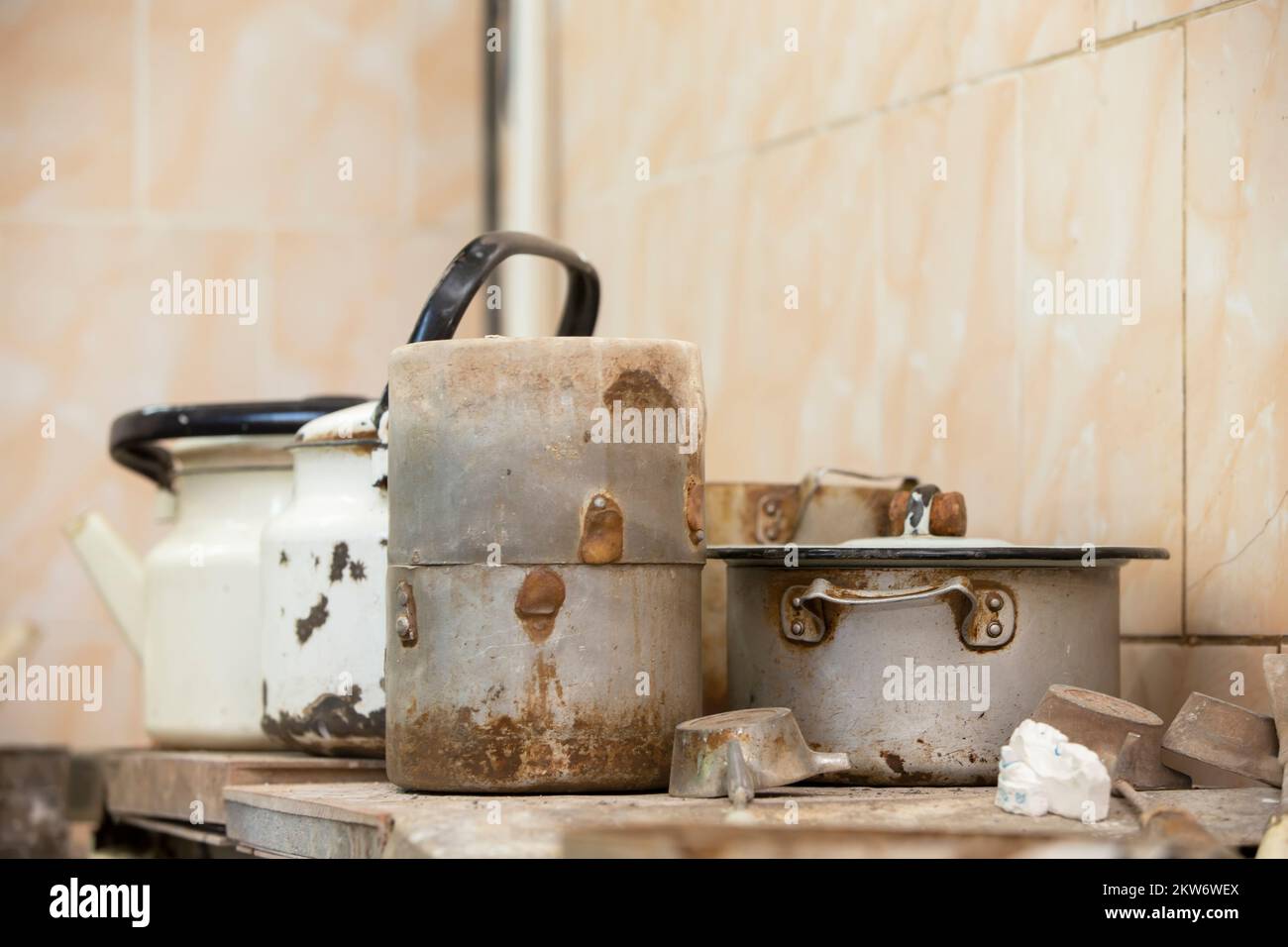 Old dirty rusty crockery pots and kettles Stock Photo Alamy