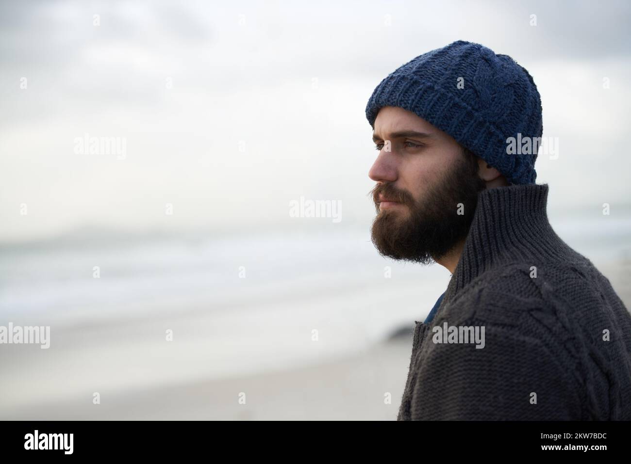 Early morning riser. a outdoorsy young man at the ocean. Stock Photo