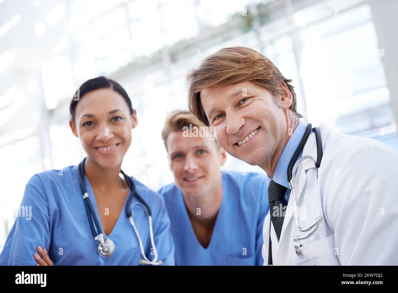 Theyre the number one team in modern medicine. A medical team standing in the hospital corridor. Stock Photo
