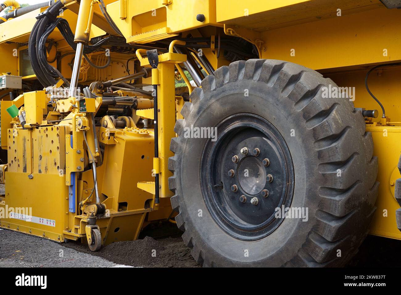 Road cold milling machine removes the old asphalt. Repaving the road