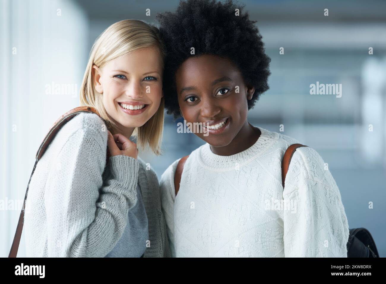 We take all our classes together. Two young college students standing