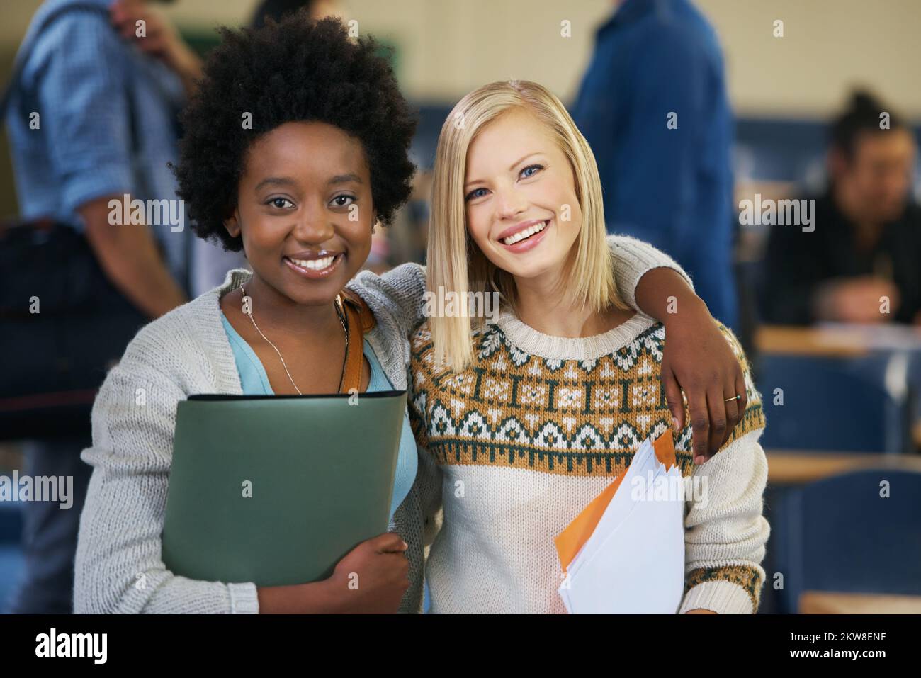Class is in session. Portrait of two university students standing