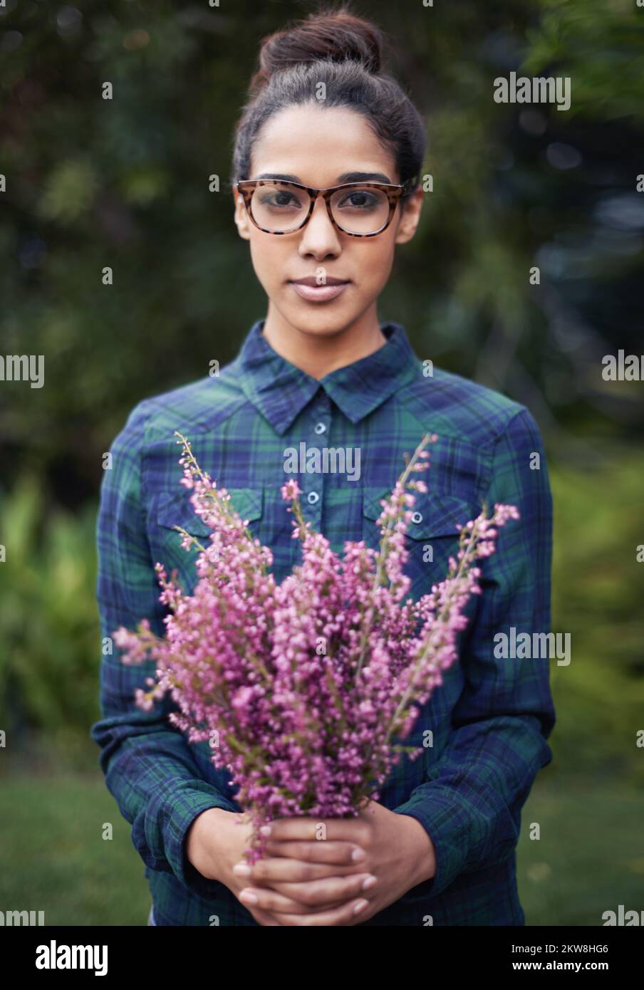 Fresh flowers for the home. A young woman holding a bunch of flowers in ...