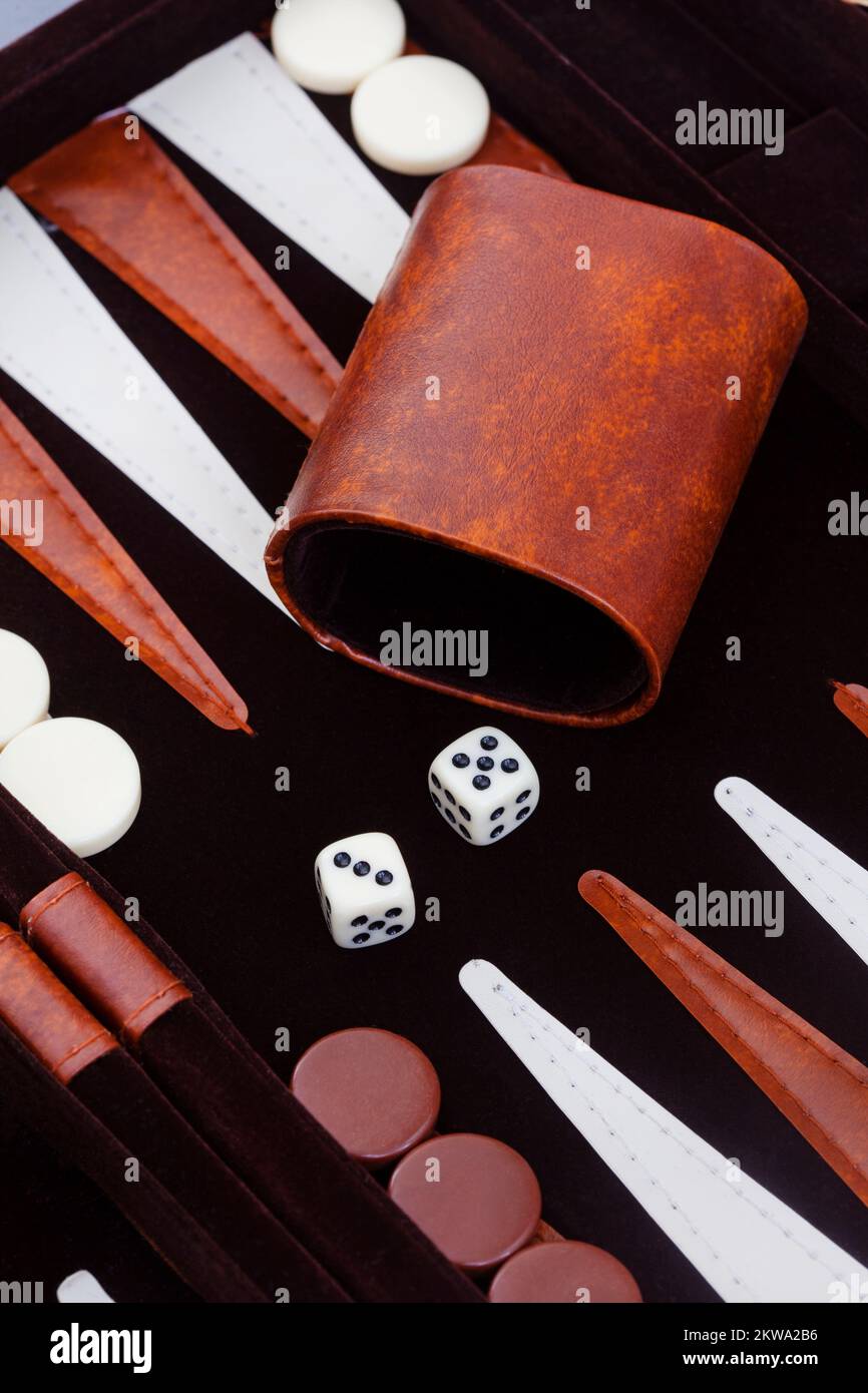 Classic game of Backgammon with beautiful brown and beige set Stock Photo
