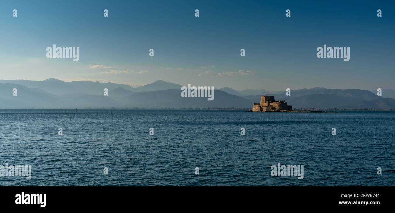 Nafplio, Greece - 10 November, 2022: panorama view of Bourtzi Castle and island in the Mediterranean Sea off the coast of Nafplio Stock Photo