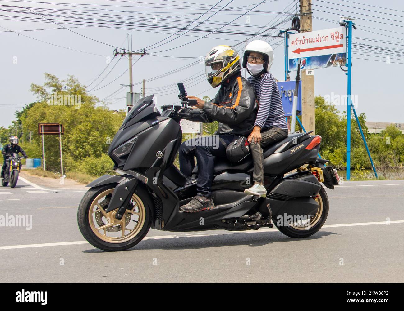 BANGKOK, THAILAND, JUNE 01 2022, The pair rides on motorcycle at the ...