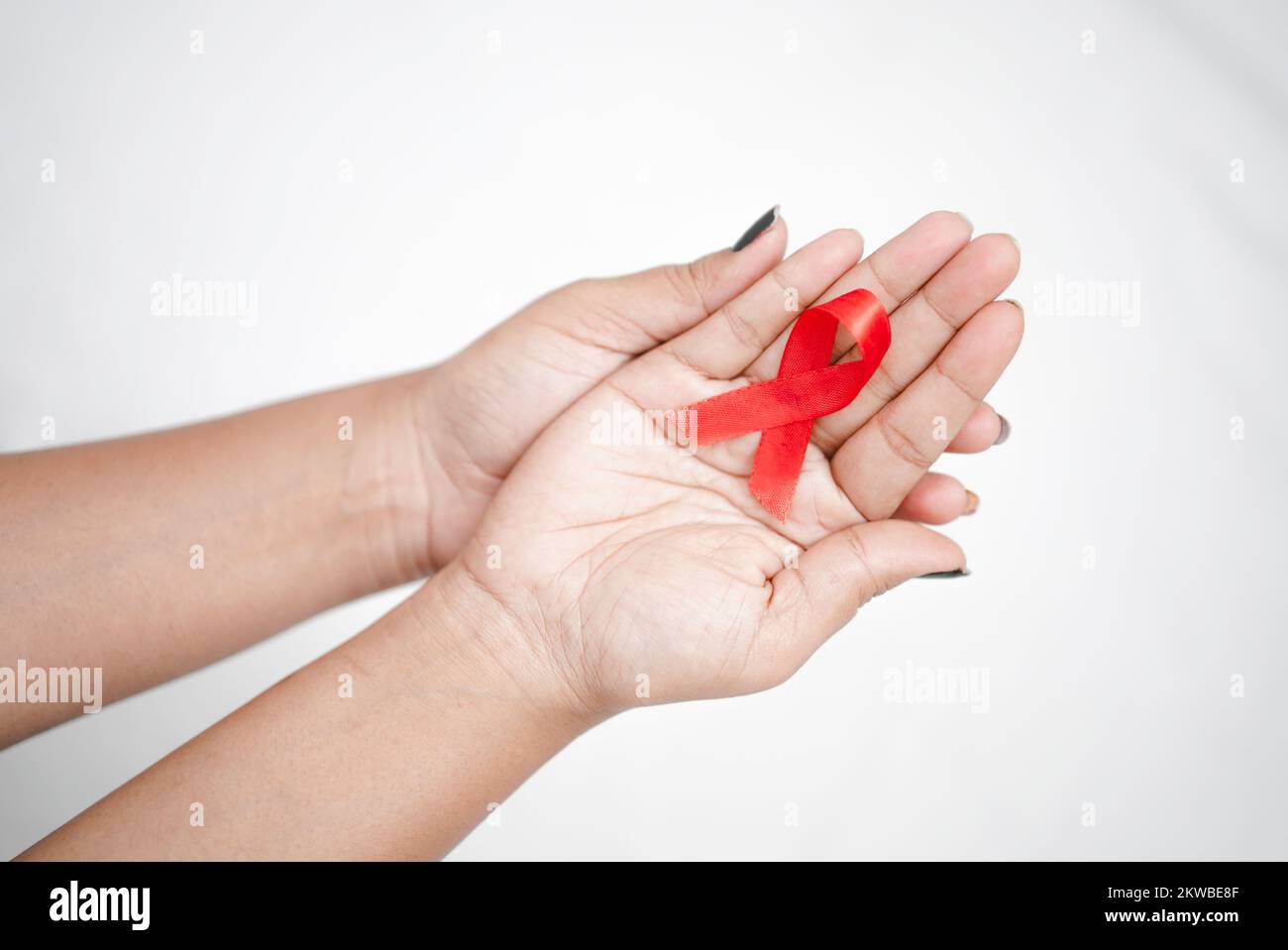 Worlds HIV Aids Day 2022-2023, Closeup hands holding red aids awareness ...