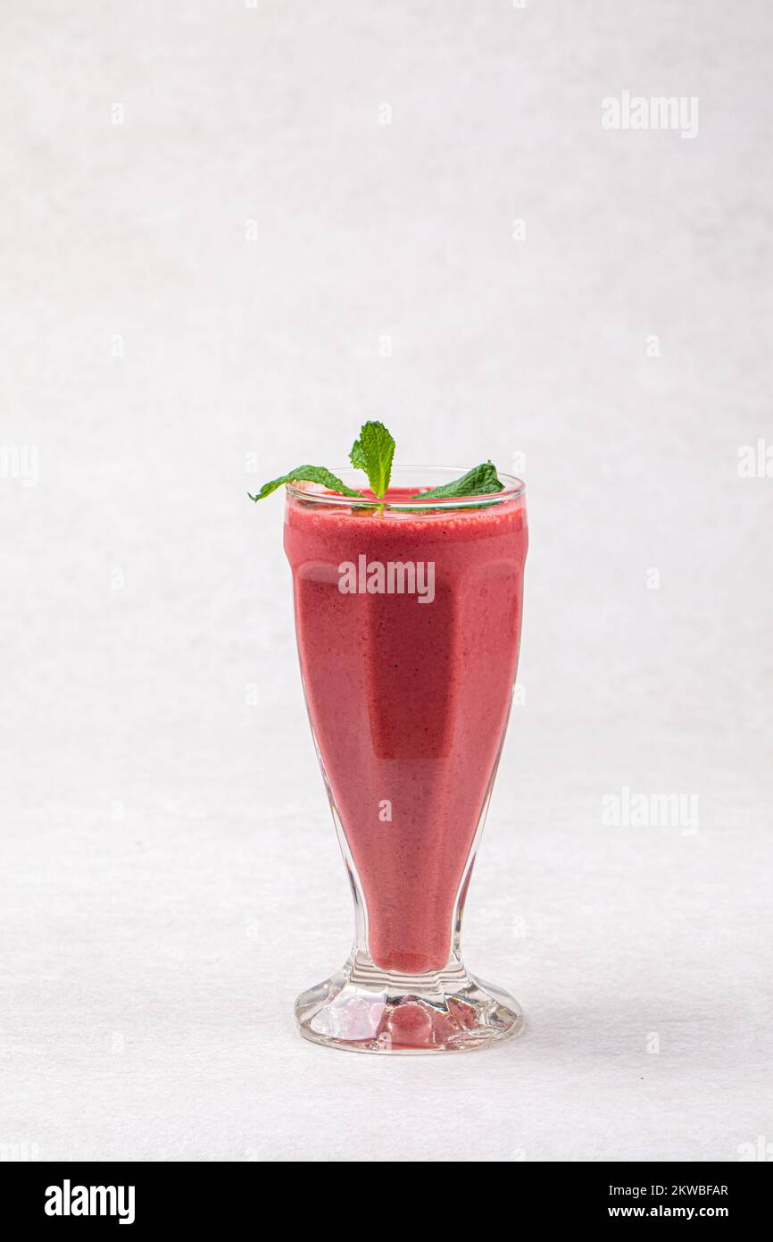 Glass of fresh berry smoothie with mint Stock Photo