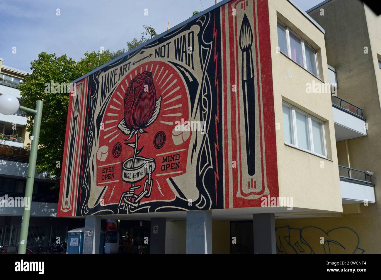 A street art mural celebrating art not war by Shepard Fairey in Mehringplatz, Kreuzberg Berlin