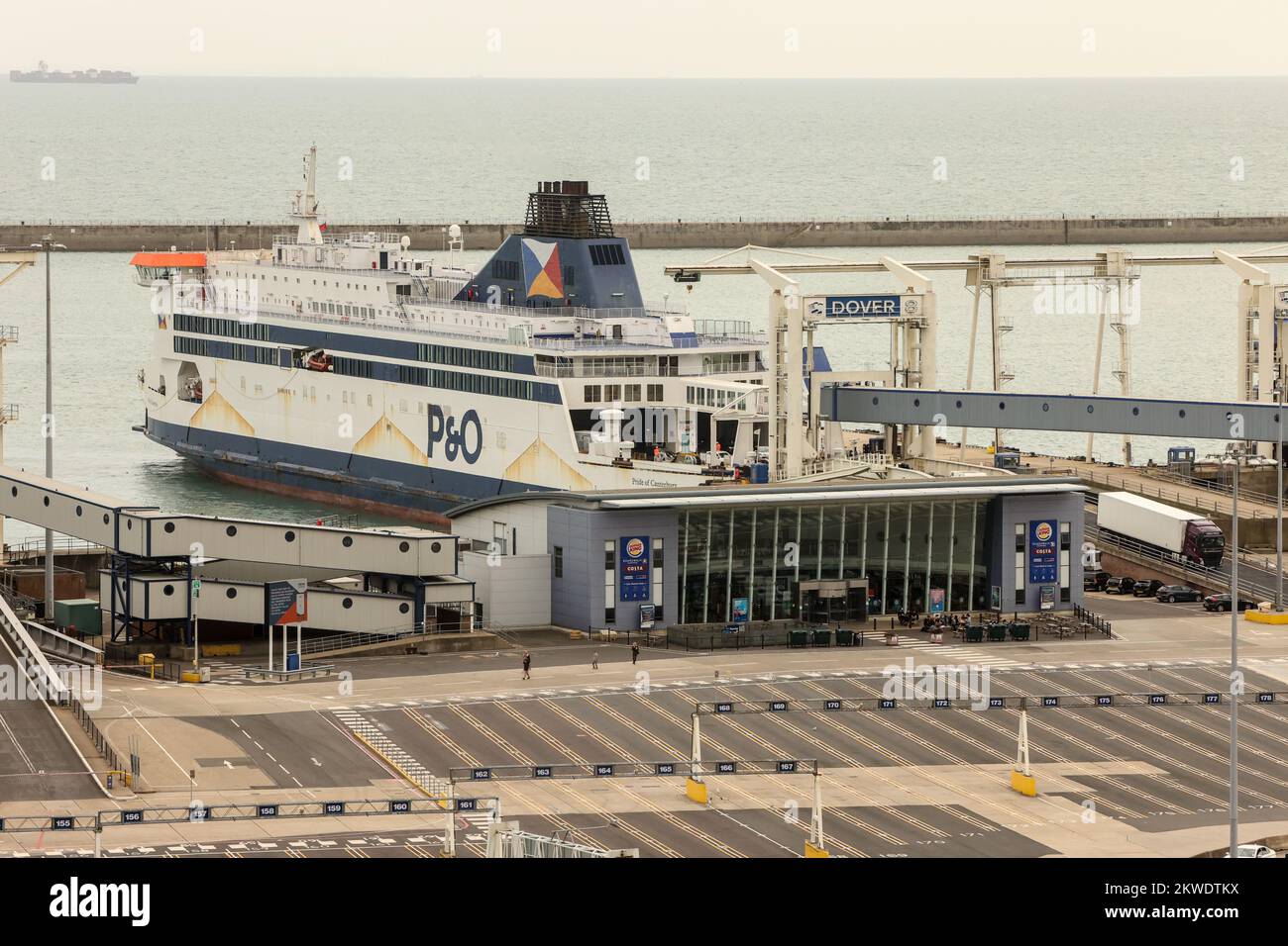P&O ferries,ferry,moored,docked,at,Port of Dover,sailing,from,Dover,to,Calais,France,at,Dover,town,Kent,White cliffs,White Cliffs of Dover,overlooking,Dover Port,Kent,England,English,coast,coastline,Kent,GB,Great Britain,Britain,British,UK,United Kingdom,Europe,European,August,summer, Stock Photo