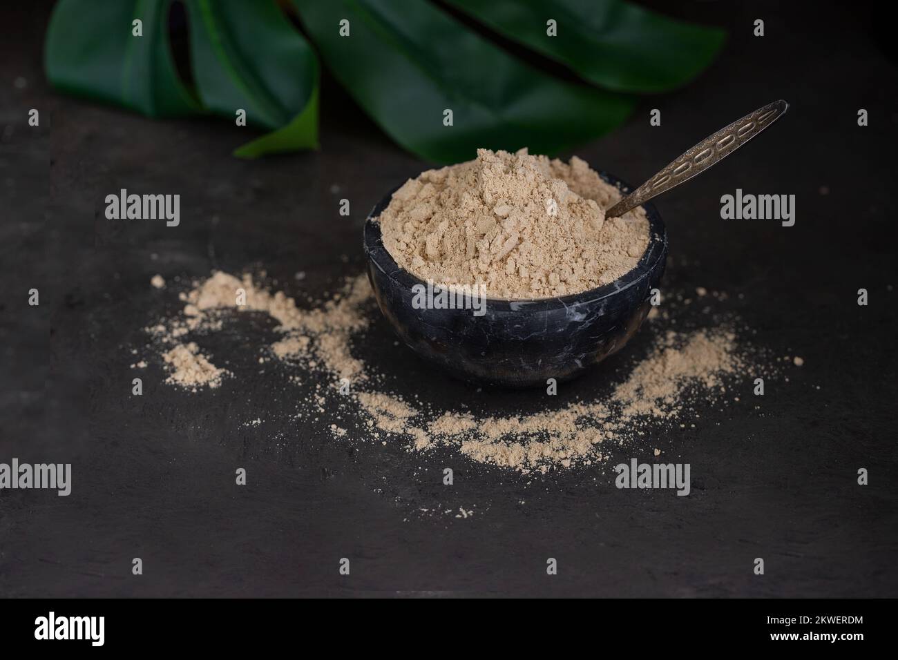 Black marble mortar with Gofio, Canarian flour made from different